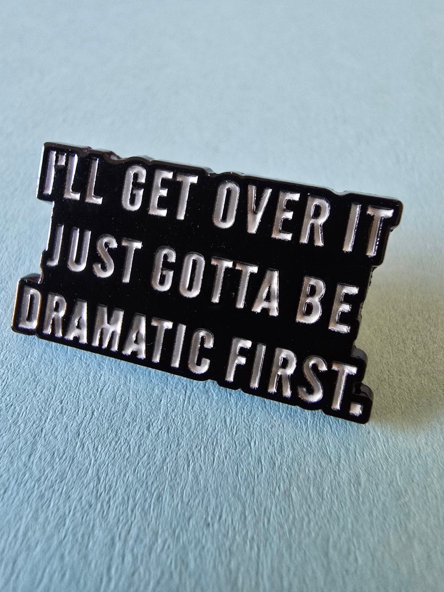 Pin be dramatic first Pins i One size från Rino Design Sthlm